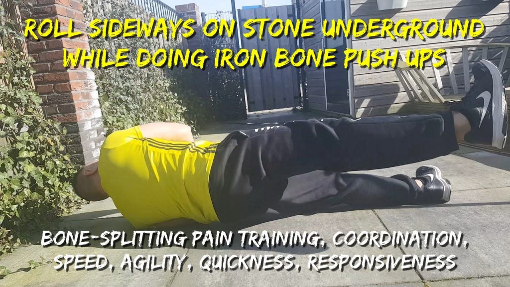 Roll sideways on stone underground while doing iron bone push ups, coordination, agility, quickness