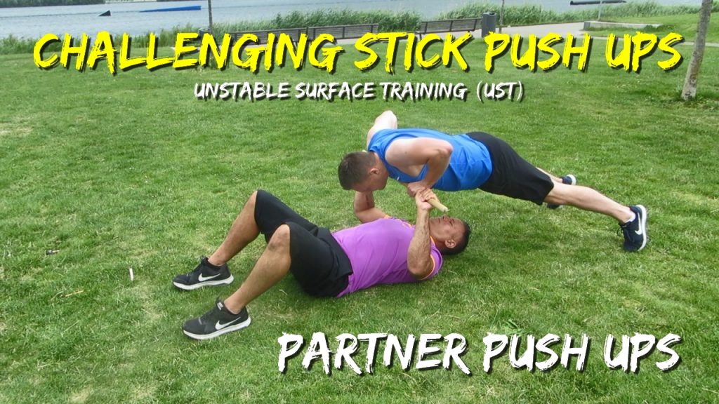 Stick push ups, challenging partner push ups with fighing stick, partner high plank push up, UST